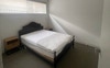Furnished bedroom with double bed