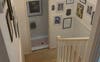 stairwell down from bedrooms. toliet on mez.