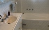 Bright large share bathroom - sep bath and shower