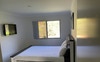 Large bedroom with built in wardrobe