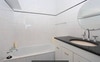 Bathroom equipped with bath and shower. 