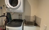 Laundry with washing machine, dryer, sink & vacuum