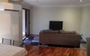 Entertainment area with couch and TV 