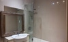 Separate bathroom with bath