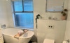 Bathroom with shower shared with 1 other.