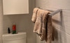 Ensuite toilet and hand rail with storage cupboard