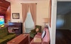 Bedroom + the Study w doors hiding behind curtains
