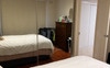 Room with furniture, bed and built in wardrobe