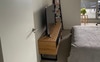 There is also room for your own bookshelf/TV unit