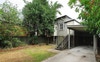 Backyard/parking and outdoor seating area.