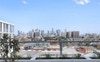 Community garden with barbecue and city view 
