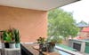 Balcony with Weber BBQ and folding clothesline 