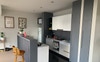 Kitchen with gas cooking, fridge and dishwasher 
