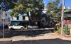 House is on the right, in the shade 