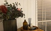 Decorative items on tall-boy clothing cabinet 