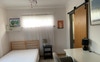 Bed and desk with large built-in cupboard