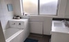 Bathroom with bath/shower. Seperate toilet 