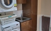 Laundry area is located in another room