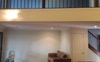 Master bedroom and loft above TV area