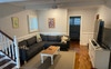 Downstairs living room and bedroom .