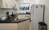 kitchen with gas cooktop, electric oven