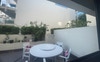 1 of the 2 large courtyards with seating  (back)