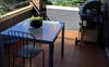 Balcony with outdoor seating and BBQ