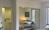 This bedroom has a door access to share bathroom. 