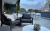 Large, partially covered outdoor balcony/garden.