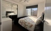 Bedroom with wardrobe, drawers & side table