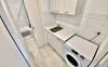 Laundry room through to the boys' bathroom