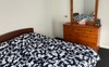 Queen room with built in robe, dresser, desk.